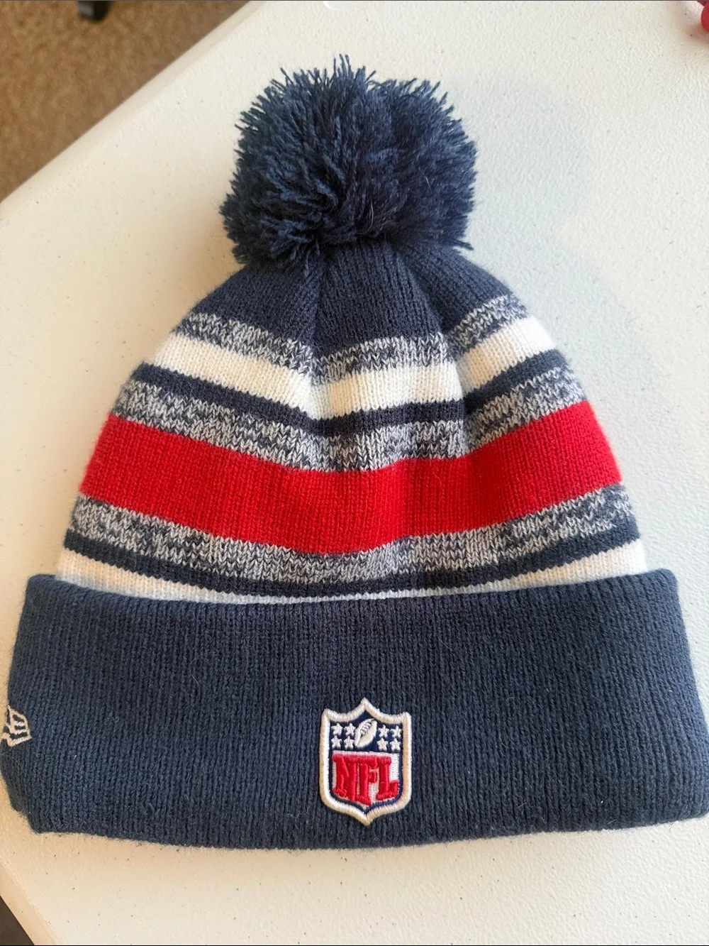 New England Patriots Navy Red Stripe Pom Beanie with Embroidered Football Logo
